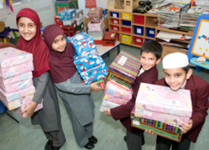 Donating gift-wrapped shoe boxes are Gatton Primary School Council Members (left to right) Aleena Salim (year 5), Mariam Elalfy (year 5), Ayoub Siddiq (year 3) and Muhammad Suleman (year 3)