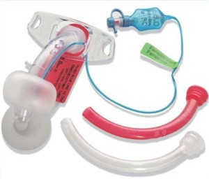Portex® Blue Line Ultra® fenestrated tracheostomy tube. Multiple fenestrations can be seen. Red colour coded inner cannula has matching multiple fenestrations. Clear white colour inner cannula has no fenestrations.
