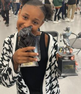 Neriya with a football trophy