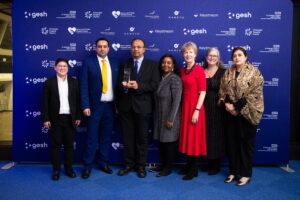Seven members of the team with their award
