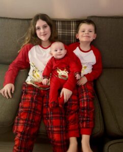Jackson with his siblings wearing Christmas pyjamas