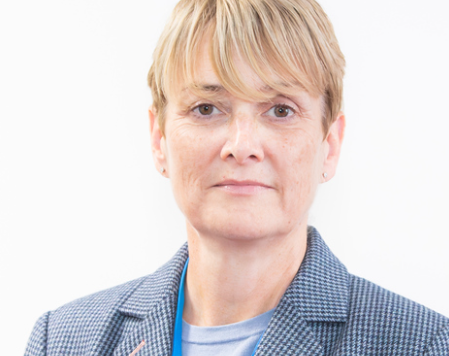 Group Chief Nurse Elaine Clancy in a checked blue and white jacket with a blue top underneath