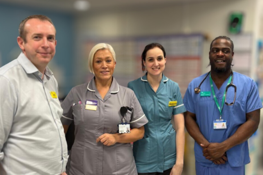 James with three colleagues