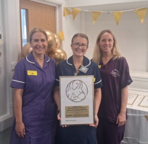 Three colleagues smiling